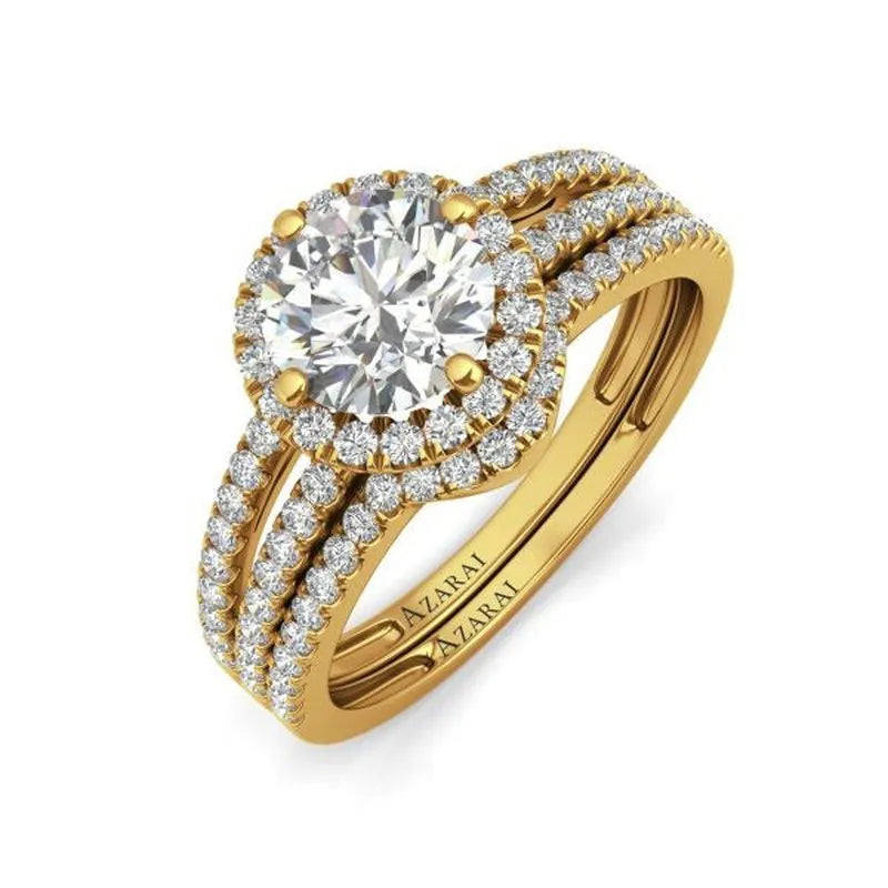 The Bella 9kt gold bridal set features a stunning large central diamond encircled by smaller diamonds on an intricately engraved band. Combining timeless elegance with modern artistry, this piece is perfect for any bridal collection.