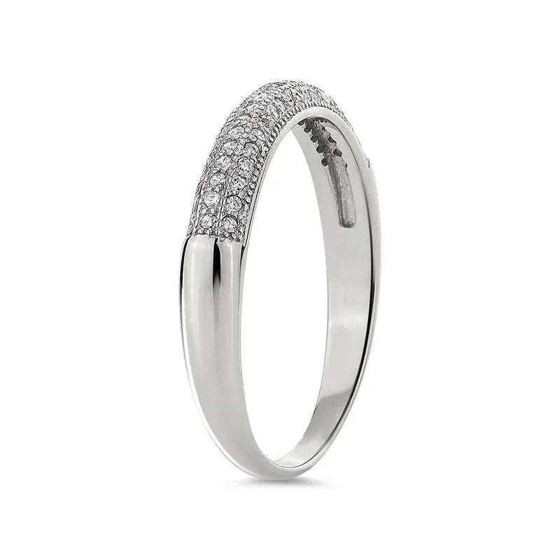 The Faye sterling silver wedding band showcases a row of small, sparkling diamonds on its upper half, making it the perfect choice for a wedding band.