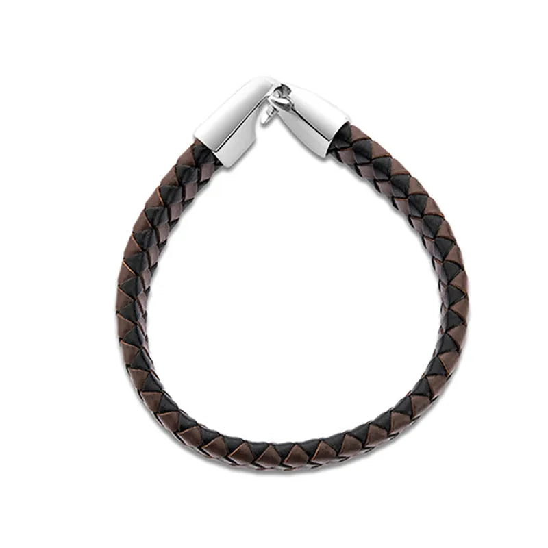 The Lynk leather bracelet for men features an elegant woven brown leather design and a sleek silver clasp, making it perfect for any occasion. Presented in stylish gift packaging and available for delivery across the country, this accessory is an exquisite gift choice.