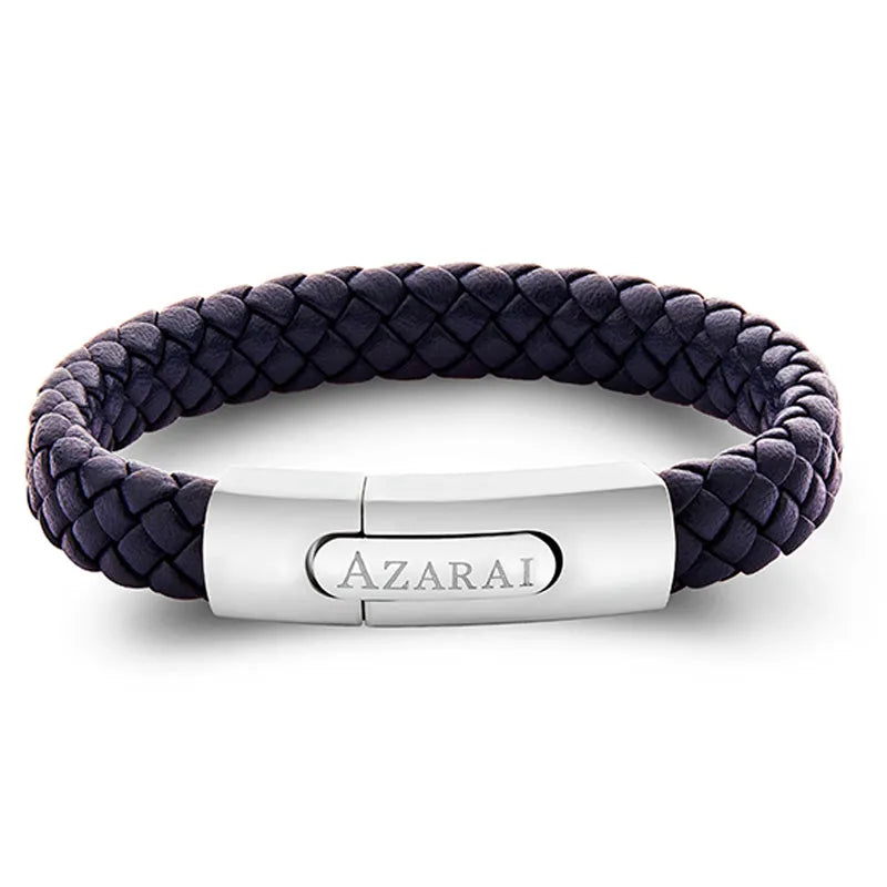 The Nemo leather bracelet for men, featuring a braided dark leather design and a metallic clasp engraved with "AZARAI," arrives in elegant gift packaging.