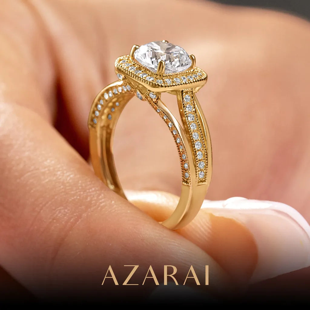 A close-up image shows a hand holding an Eloise 14kt gold engagement ring, showcasing a large diamond highlighted by smaller ones along the band. In the background, the name "Azarai" is elegantly displayed at the bottom.