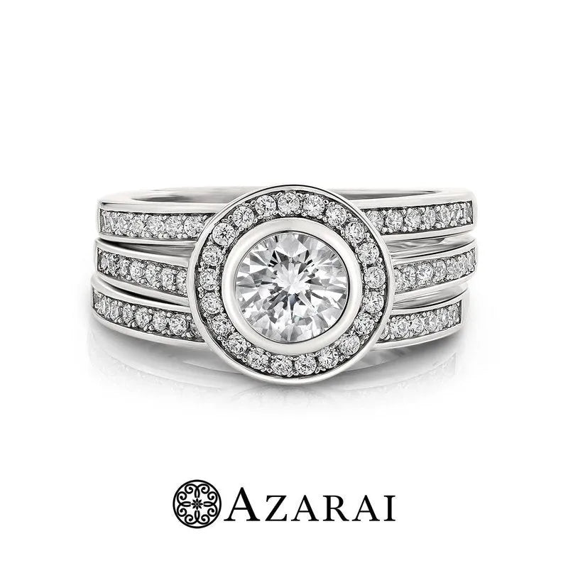 A sterling silver bridal set featuring a large round diamond in the center, surrounded by smaller diamonds, against a white background. The text "AZARAI" is displayed beneath the image. Product: Chamise sterling silver bridal set ON CLEARANCE.