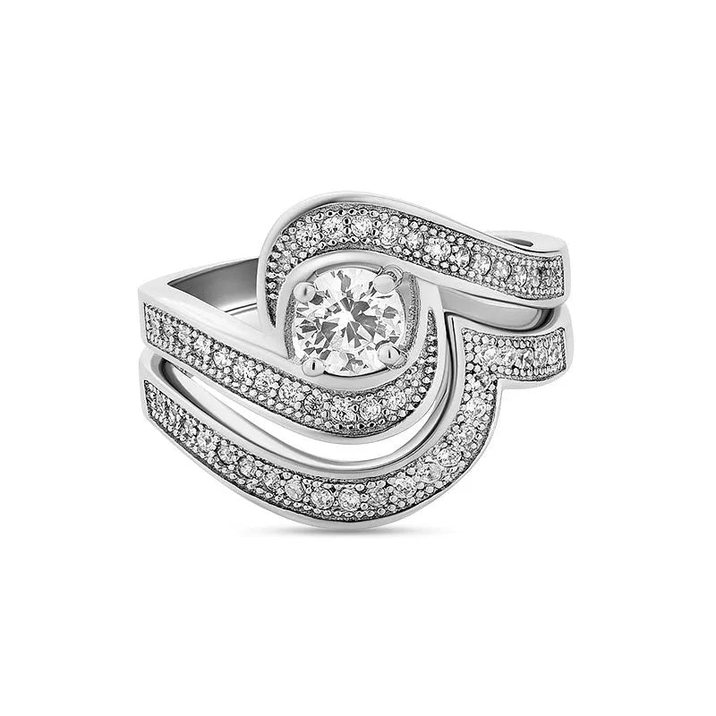 The Katrina sterling silver bridal set ON CLEARANCE showcases a breathtaking diamond ring, featuring a central stone encircled by wavy bands adorned with smaller diamonds.