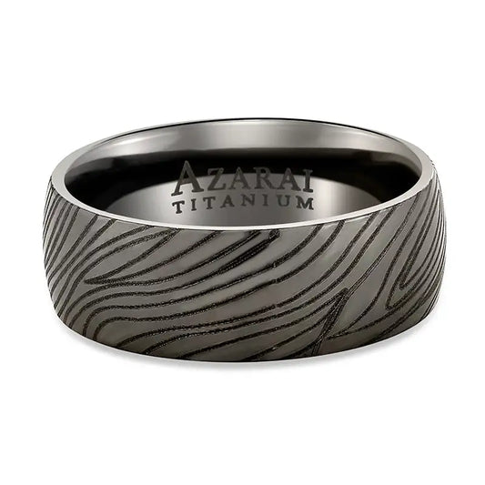 An Umbra black titanium wedding band with a black marbled pattern.