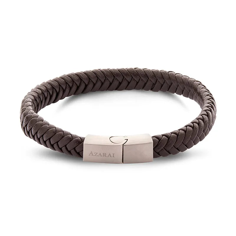 The Sabre leather bracelet for men is an exquisite brown braided piece featuring a metallic clasp engraved with "Azarai." Ideal for gifting, it arrives in elegant gift packaging and is available for nationwide delivery.