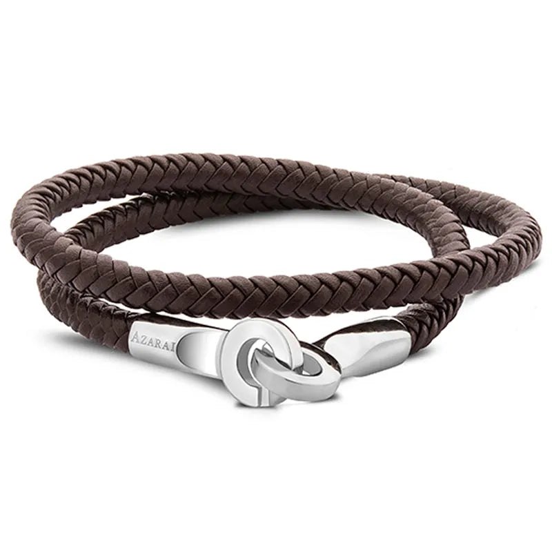 The Torq leather bracelet for men is a brown braided design with a silver clasp, featuring the engraving "AZARAI." This elegant accessory is perfect for any occasion and comes with exquisite gift packaging. Enjoy convenient nationwide delivery to ensure it reaches you or your loved ones swiftly.