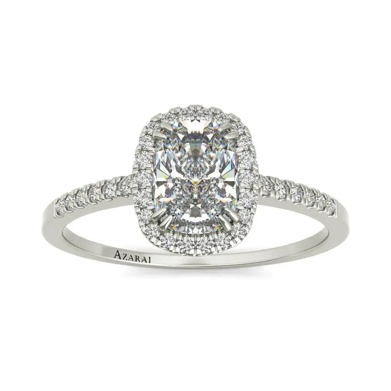 The Adeline 9kt gold engagement ring showcases a breathtaking oval-cut diamond at its center, surrounded by a delicate halo of smaller diamonds. The band is elegantly crafted with additional diamonds, creating a timeless symbol of love and commitment.