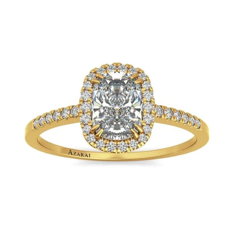 Introducing the Adeline 9kt gold engagement ring, featuring a stunning cushion-cut center diamond encircled by a halo of smaller diamonds, with more diamonds gracefully adorning the band.