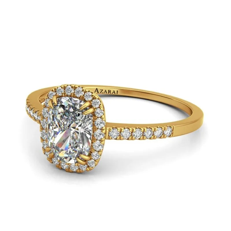 The Adeline 9kt gold engagement ring shines brilliantly with a prominent central diamond encircled by smaller diamonds, and is further adorned with additional sparkling gems along the band.