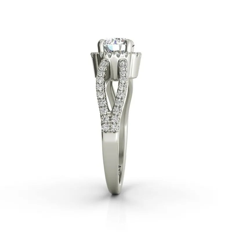 The Angelika sterling silver engagement ring ON CLEARANCE features a breathtaking round diamond centerpiece, complemented by smaller diamonds adorning the band.