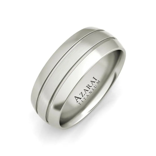 The Angus titanium wedding band is a distinguished ring for men, featuring dual grooves and an elegant engraving of "Azarai Titanium" on the inside.