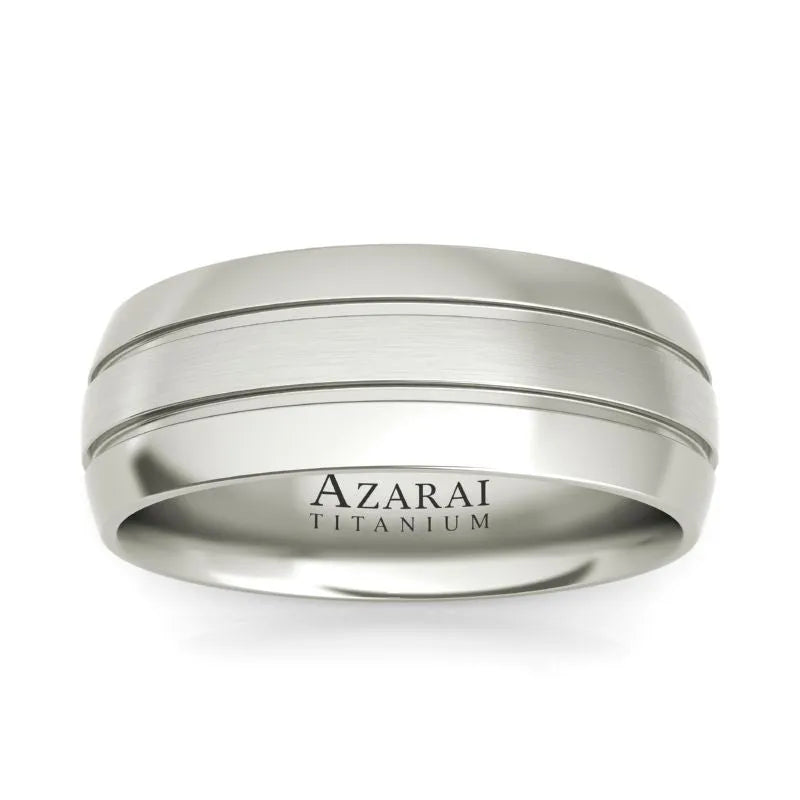 The Angus titanium wedding band for men showcases two engraved lines and has "Azarai" inscribed on the inside.