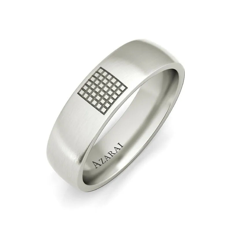 The Aspen sterling silver wedding band features a grid pattern on top and "AZARAI" engraved on the inner band, making it perfect for men.