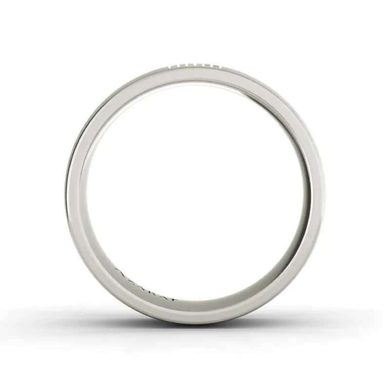 The Aspen sterling silver wedding band, a plain white circular ring, stands elegantly at the center of a pristine white background.