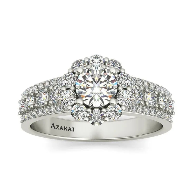 The Auburn 9kt gold engagement ring showcases a large central diamond surrounded by smaller diamonds on the band, with intricate detailing that sparkles as brilliantly as auburn hues at sunset.