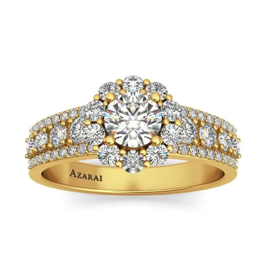 Introducing the Auburn 9kt gold engagement ring, showcasing a dazzling central diamond encased in gold, enhanced by a radiant halo of smaller diamonds and adorned with additional diamonds along the band.