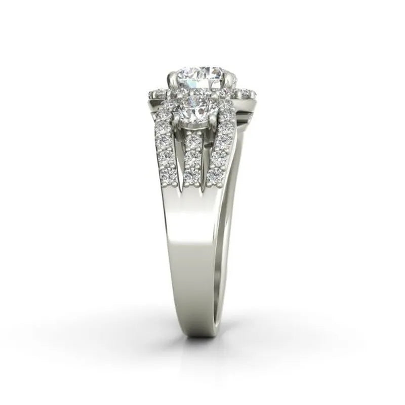 The Aurora sterling silver engagement ring showcases a stunning large central diamond, elegantly accented by smaller diamonds set along the band.