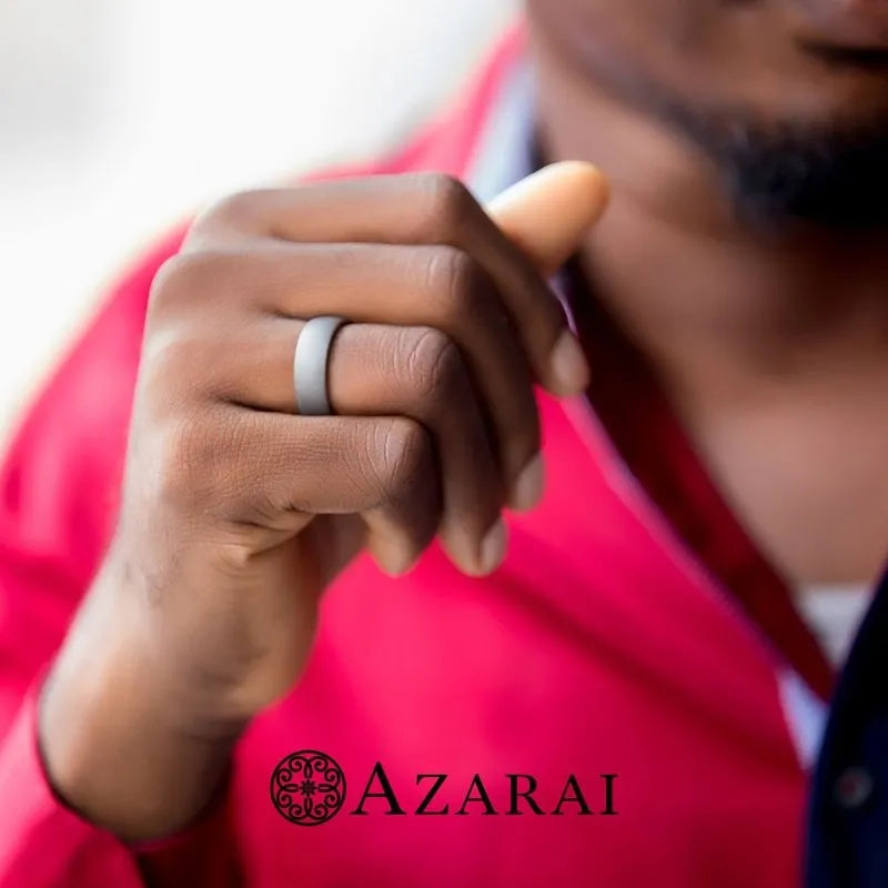 A person in a red shirt displays a Baylor titanium wedding band on their hand, with the brand name visible below.