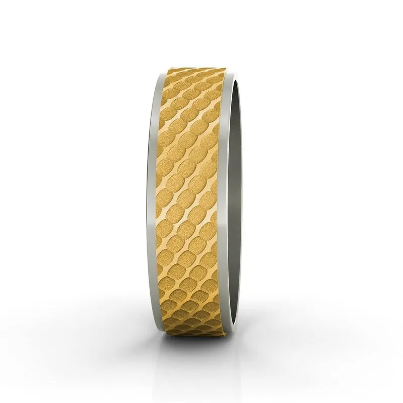 Product Data: The Berkeley 18kt gold wedding band features an intricate textured design with smooth silver edges, beautifully crafted for men and showcased against a white background.