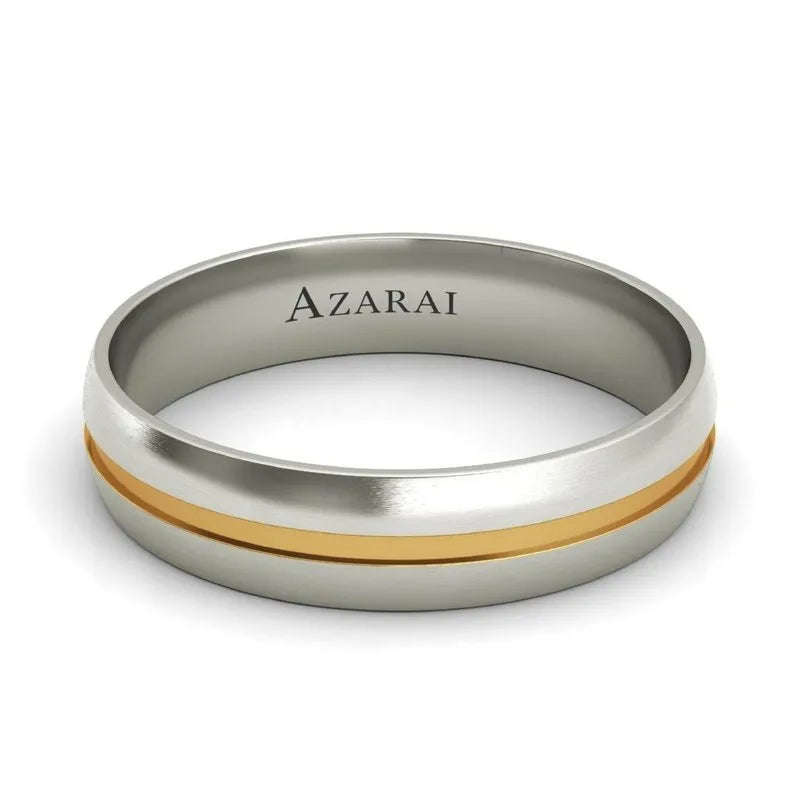 Introducing the Burke 18kt gold wedding band, a silver men's wedding band showcasing a distinctive gold stripe at its center, with "AZARAI" elegantly engraved on the inside.