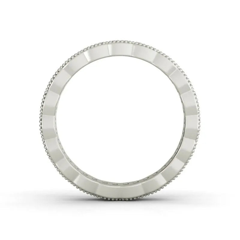 The Carlotta sterling silver wedding band features a grooved design and beaded edges, elegantly showcased from the front on a white background. This stunning piece captures timeless grace and sophistication, making it an ideal choice for a wedding band.