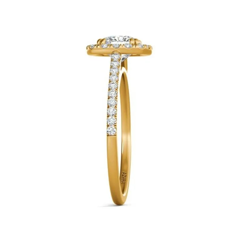 The Celeste 14kt gold engagement ring features a breathtaking design with a diamond-encrusted band and a large round diamond centerpiece, viewed from the side, radiating celestial elegance.