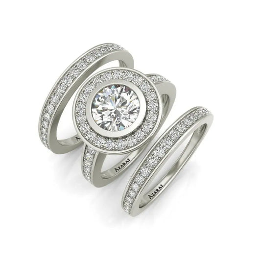 The Chamise sterling silver bridal set ON CLEARANCE showcases a multi-band ring featuring a large central diamond encircled by smaller diamonds, making it an ideal choice for any bridal collection.