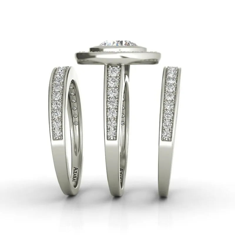 A vertical display of three sterling silver rings with small embedded diamonds showcases the Chamise bridal set, now on clearance. The middle ring, ideal for bridal wear, features a raised round diamond.