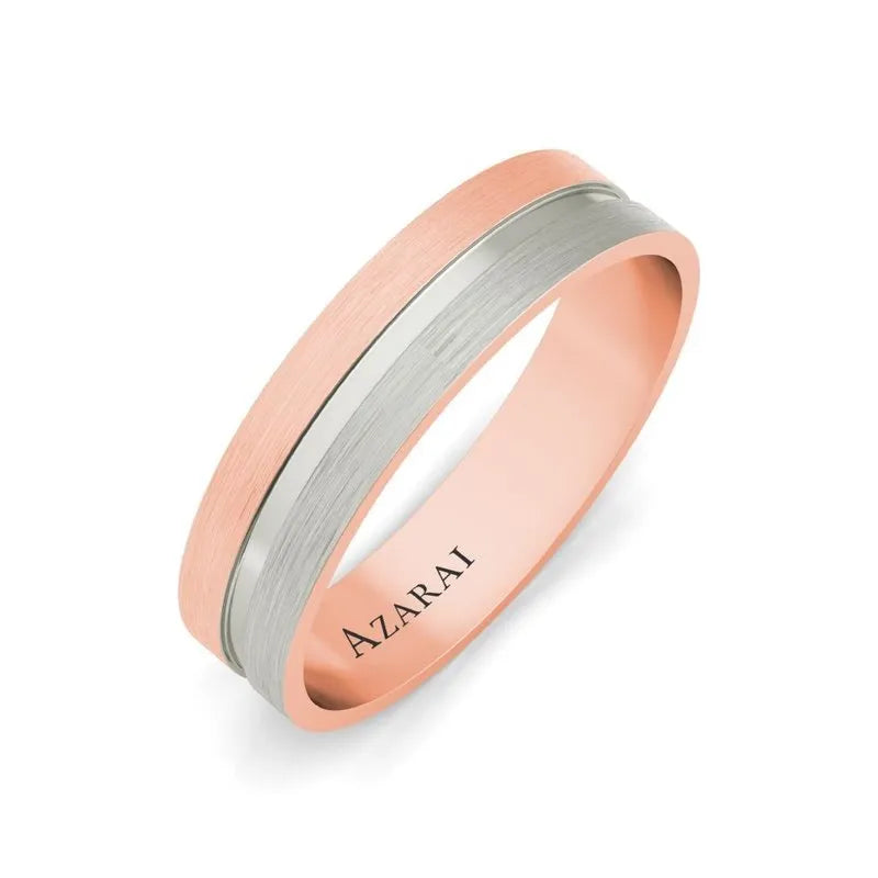 The Chandler 18kt gold wedding band is a stylish two-tone ring with silver and rose gold bands, engraved with "AZARAI" inside, ideal for those seeking elegance.