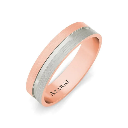 The Chandler 18kt gold wedding band is a sophisticated and modern two-tone ring featuring a rose gold and silver band, crafted from exquisite 18kt gold and engraved with "AZARAI." Perfect for those seeking a timelessly elegant men's wedding band.