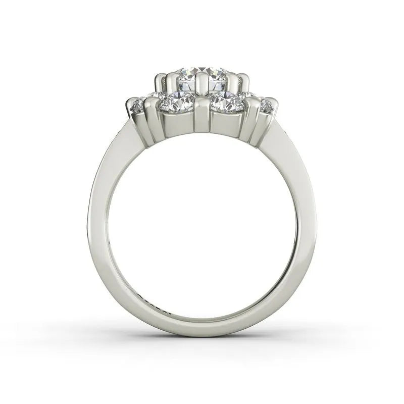 Introducing the Charlotte sterling silver engagement ring, now on clearance. This exquisite piece showcases a prominent central diamond tastefully complemented by two smaller diamonds on a sleek, unadorned band. Its radiant beauty is unparalleled, especially when viewed from the side. Add this timeless symbol of elegance and devotion to your collection today.