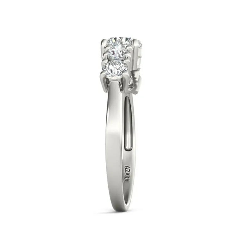 The Circa 9kt gold engagement ring elegantly features three round diamonds set in a row on a polished band, exuding timeless charm.