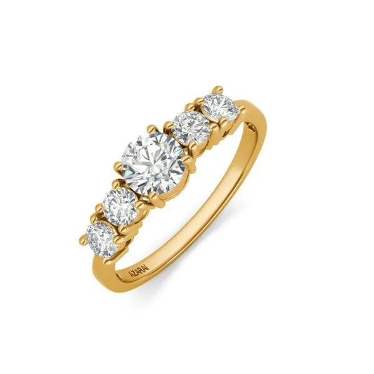 This Circa 9kt gold engagement ring, from the late 20th century, features an exquisite design with a row of five round diamonds and a magnificent larger central diamond at its center.