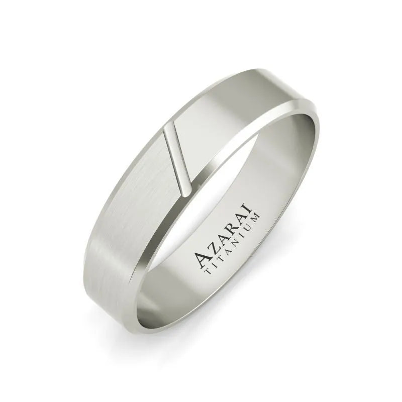 The Laurent titanium wedding band for men showcases a silver matte design with a delicate diagonal groove. The interior is engraved with "AZARAI TITANIUM," offering an exceptional choice for your special day.