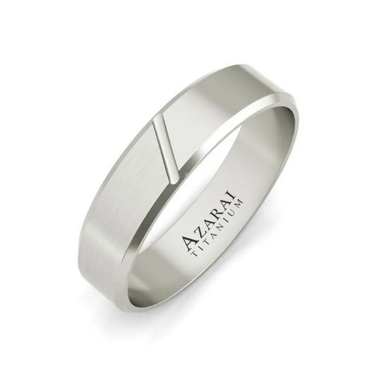 The Laurent titanium wedding band for men showcases a silver matte design with a delicate diagonal groove. The interior is engraved with "AZARAI TITANIUM," offering an exceptional choice for your special day.