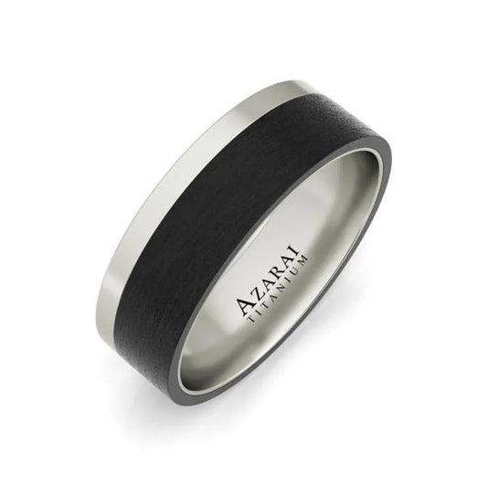 The Downing Carbon Fibre Wedding Band is a titanium men's wedding band showcasing a sleek black carbon fiber band in the center, beautifully engraved with "AZARAI TITANIUM" on the inner side.