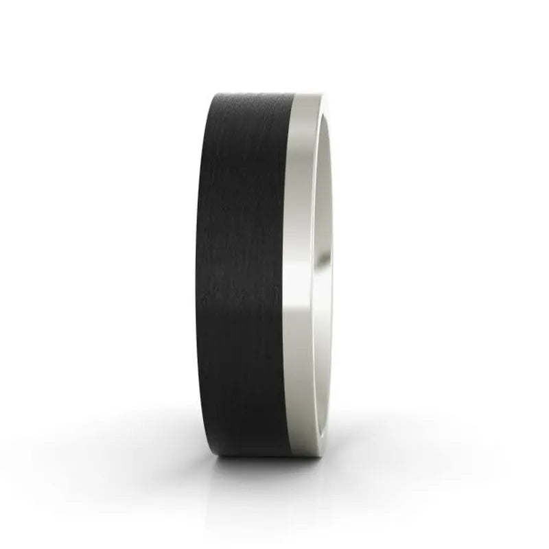 The Downing carbon fibre wedding band stands vertically against a white background, featuring its black ring accented with a metallic edge for a modern touch.