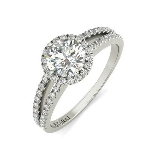 The Bella sterling silver engagement ring showcases a stunning round diamond centerpiece, beautifully encircled by smaller, sparkling diamonds.