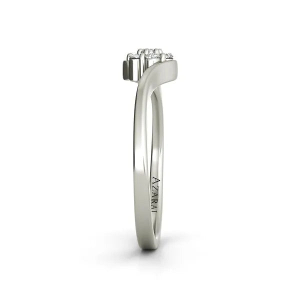 Side view of the Fleur sterling silver engagement ring featuring a cluster of small diamonds on top. The word "AZTARI" is engraved on the band, adding a touch of bespoke charm to this elegant piece.