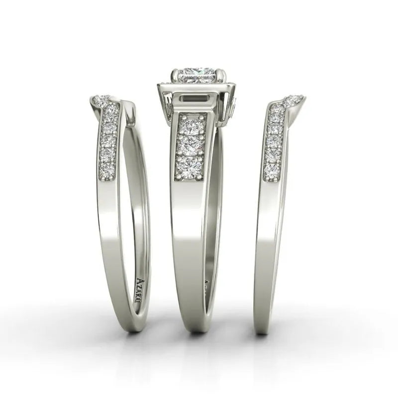 The Henriette sterling silver bridal set, currently on clearance, showcases three exquisite rings with diamond accents, elegantly displayed from various angles against a plain white background, embodying timeless sophistication.