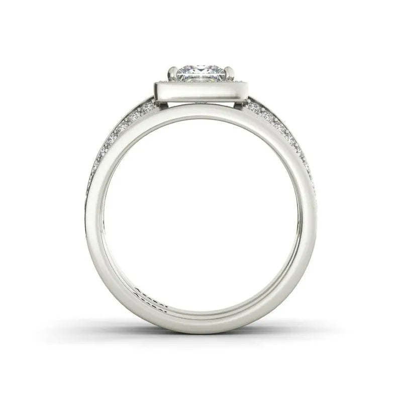 Side view of the Hepburn sterling silver bridal set ON CLEARANCE features a central diamond with smaller stones along the band, ideal for an exquisite engagement ring.