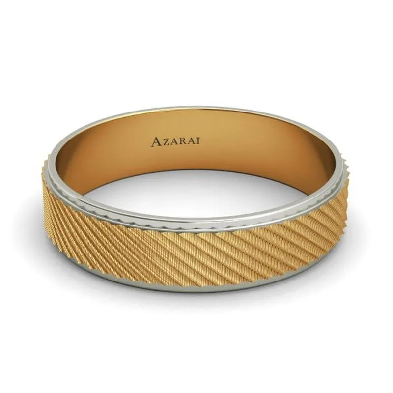 A 9kt gold wedding band with a textured pattern, featuring "AZARAI" inscribed on the inner band, is currently available in the clearance collection under the name Holt.