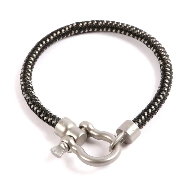 Introducing the Kane braided men's bracelet, designed with a stylish black and white pattern and finished with a durable stainless steel shackle clasp.