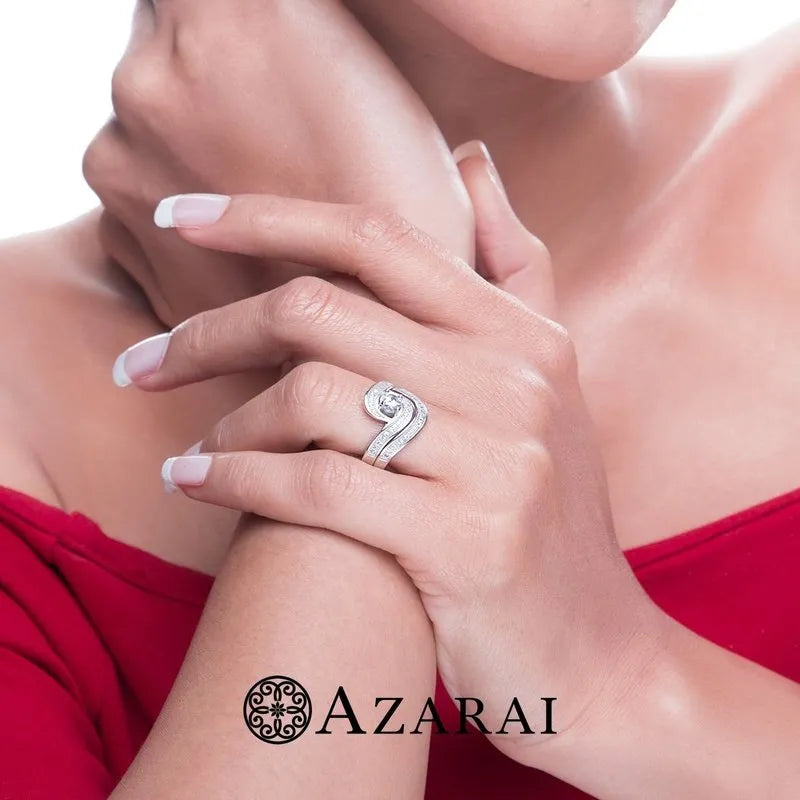 A person in a red top with arms crossed, displaying the Katrina sterling silver bridal set from the clearance collection on their finger. The word "AZARAI" is at the bottom.