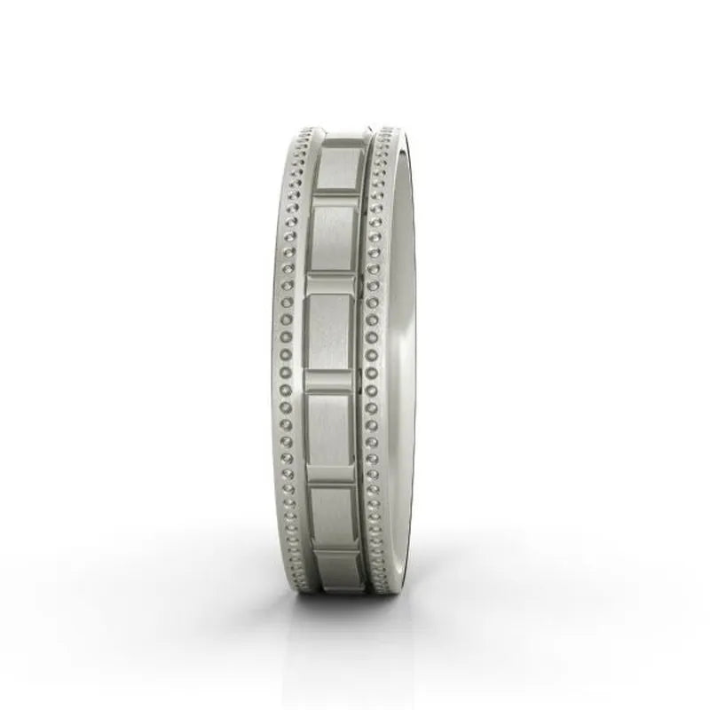 The Langston sterling silver wedding band, featuring a textured band and beaded edges, is perfect as a men's wedding ring and is beautifully displayed against a white background.