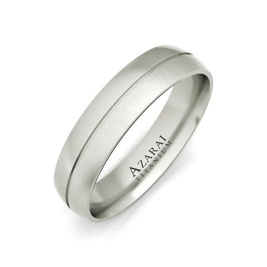 The Madison titanium wedding band, crafted in silver, features a brushed finish and is elegantly engraved with the word "AZARAI.