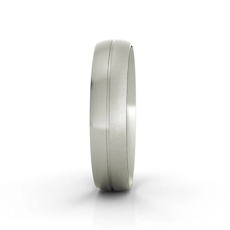 Introducing the Madison titanium wedding band: a stunning silver titanium piece featuring a smooth, polished surface and a subtle groove around its center. Displayed upright against a white background, this ring radiates timeless elegance.