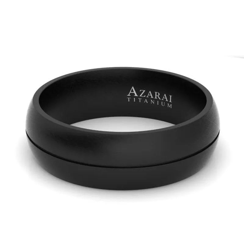 The Maverick black titanium wedding band for men showcases the inscription "AZARAI TITANIUM" on its interior, combining contemporary style with timeless sophistication.