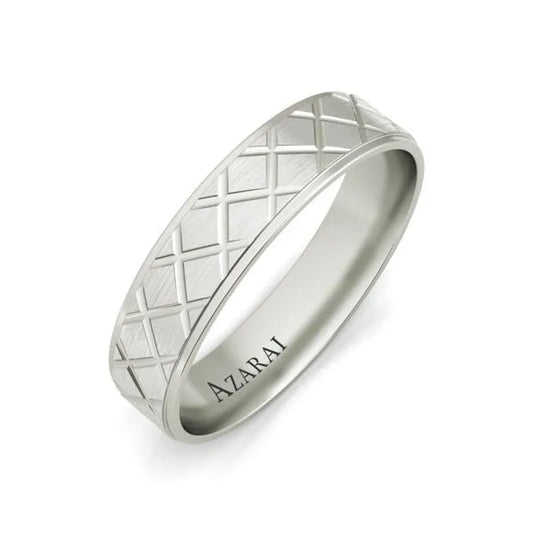 The Mitchell sterling silver wedding band showcases a crisscross pattern engraved on the band, making it an ideal choice for a men's wedding ring. Inside, the word "AZARAI" is inscribed, adding a touch of unique elegance to this timeless piece.