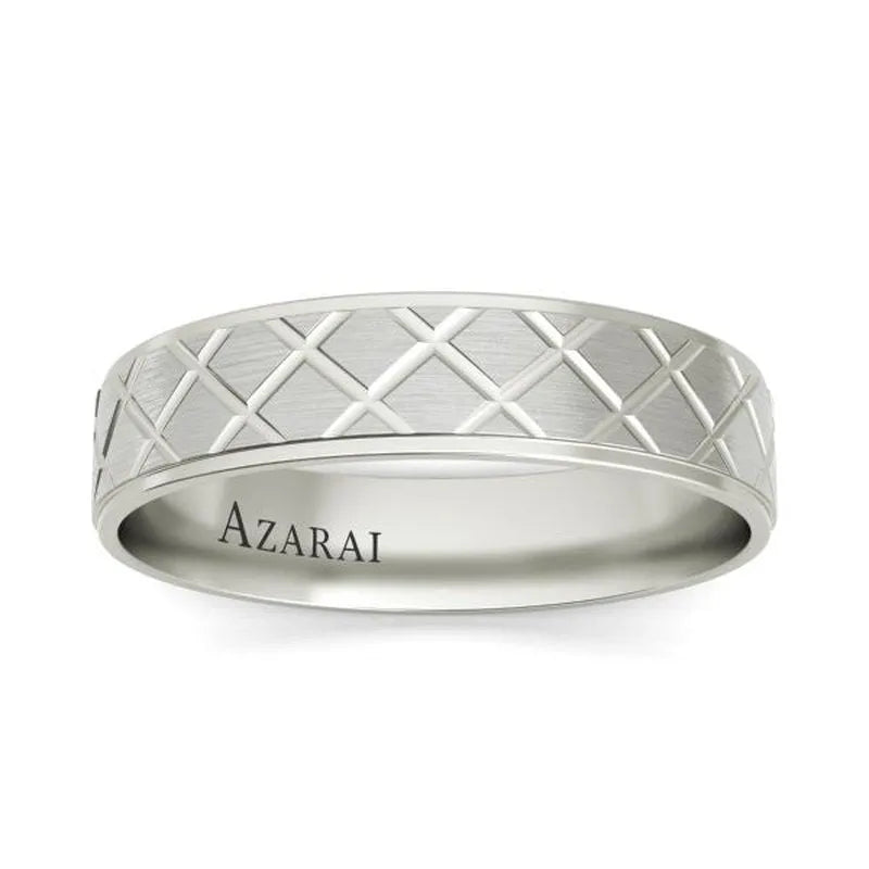 The Mitchell sterling silver wedding band is adorned with a quilted pattern, making it an ideal choice for a men's wedding ring, and it features the name "Azarai" engraved on its inner band.